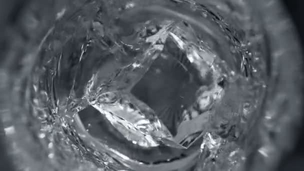 Super Slow Motion Detail Shot Ice Cube Falling Glass Vodka — Stock video