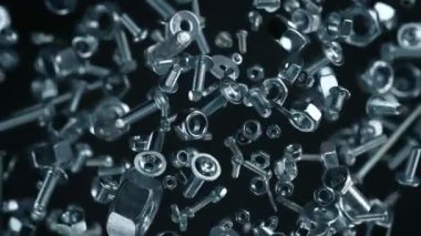 Süper Yavaş Çekim Fasteners Explosion Against Black 'in 1000fps' te izole edilmiş hali. 4K 'da Yüksek Hız Sinema Kamerası ile çekildi..