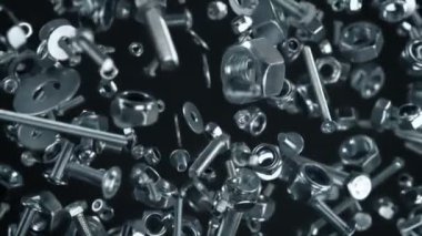 Süper Yavaş Çekim Fasteners Explosion Against Black 'in 1000fps' te izole edilmiş hali. 4K 'da Yüksek Hız Sinema Kamerası ile çekildi..