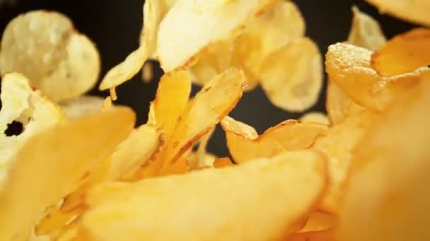 Super Slow Motion Shot Premium Potato Chips Falling Dark Background — Stock Video