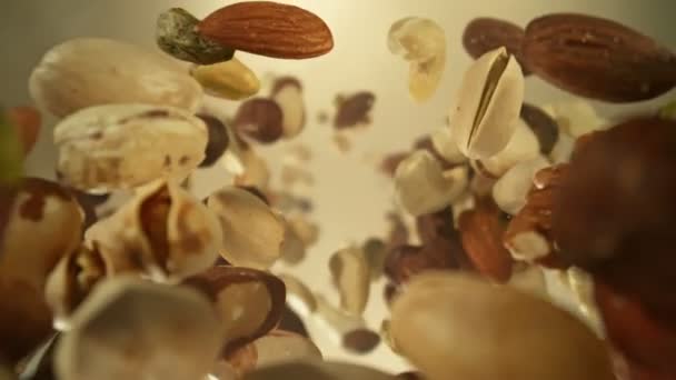 Super Slow Motion Closeup Shot Falling Rotating Various Nuts Camera — Vídeo de Stock