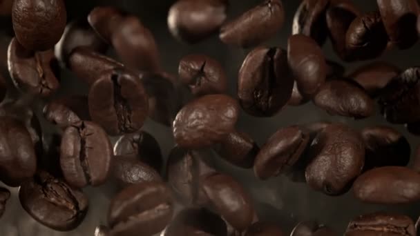 Super Slow Motion Macro Shot Flying Premium Coffee Beans Isolato — Video Stock