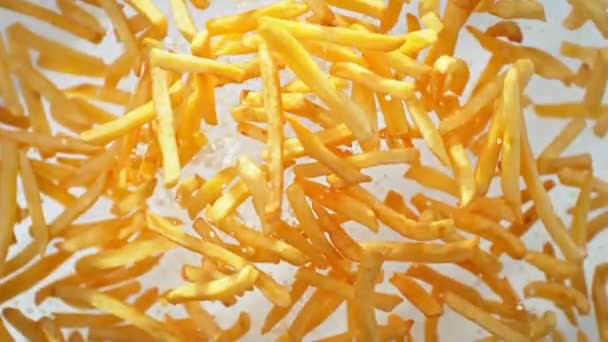 Super Slow Motion Shot French Fries Salt Flying Camera White — Stock video