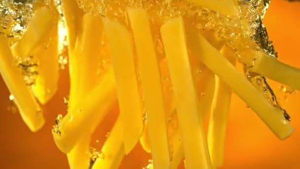 Super Slow Motion Shot Fresh Raw French Fries Falling Boiling — Stock video