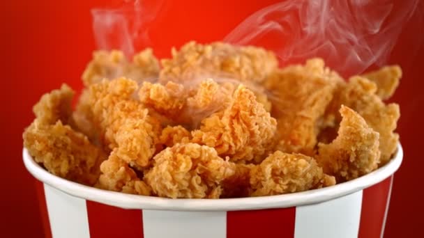 Slow Motion Shot Fried Chicken Bites Smoke Rotating Bucket Red — Stock Video