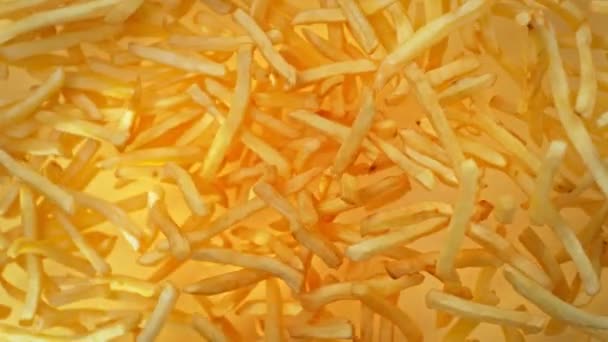 Super Slow Motion Shot French Fries Flying Camera Golden Background — Stock video