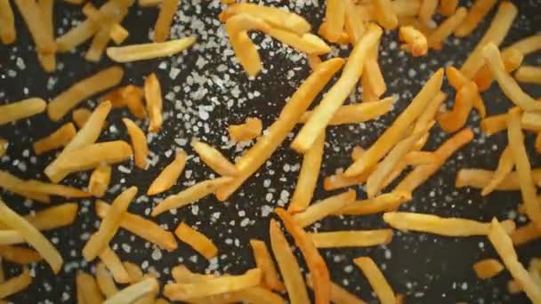 Super Slow Motion Shot French Fries Salt Flying Camera Dark — Stock video