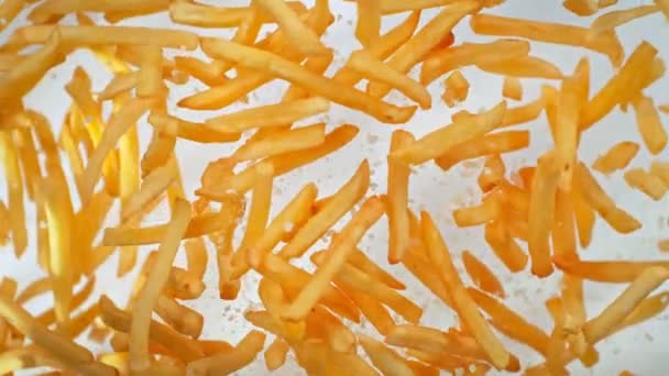 Super Slow Motion Shot French Fries Salt Flying Camera White — Stock video