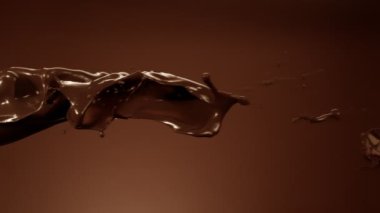 Süper Yavaş Çekim Çikolata Damlaları Uçuyor ve 1000 fps hızla yere çakılıyor. Yüksek Hız Sinema Kamerası, 4k.