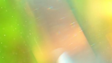 Soyut Bokeh Yeşil Arkaplanının Süper Yavaş Çekimi. Güneş patlamaları ve parçacıkları ile birlikte. Yüksek Hız Sinema Kamerası, 4K.