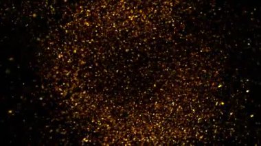 Süper Yavaş Çekim Altın Parıldayan Parçacıklar. Siyah üzerine izole edilmiş ve yüksek hızlı sinema kamerasıyla çekilmiş, 4K.
