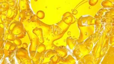 Süper Yavaş Çekim Altın Yağ Suyu 'nun 1000fps hızında akışı. Yüksek Hız Sinema Kamerası, 4K.