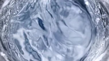 Super Slow Motion Detail shot of Waving Votka in Glass 1000 fps 'de. 4K 'da Yüksek Hız Sinema Kamerası ile çekildi..