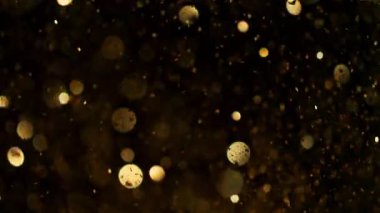 Parıldayan Altın Arkaplan 'ın Süper Yavaş Çekimi, 1000fps' de. Yüksek Hız Sinema Kamerası, 4K.