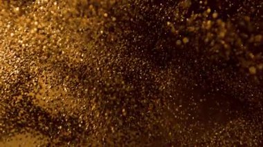 Parıldayan Altın Arkaplan 'ın Süper Yavaş Çekimi, 1000fps' de. Yüksek Hız Sinema Kamerası, 4K.