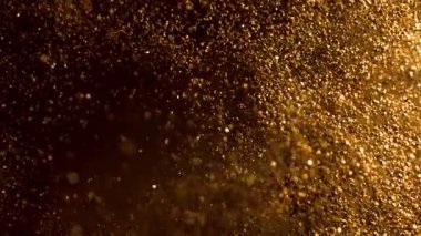 Parıldayan Altın Arkaplan 'ın Süper Yavaş Çekimi, 1000fps' de. Yüksek Hız Sinema Kamerası, 4K.