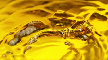 Dalgalanan Altın Sıvı Arkaplanının Süper Yavaş Çekimi, 1000fps. Yüksek Hız Sinema Kamerası, 4K.