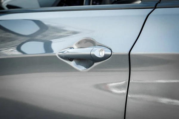 stock image Handle with lock of a silver car door, close-up.