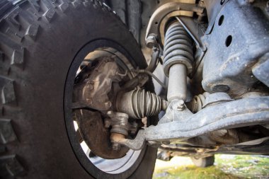 Car steering and suspension system of a suv. Close-up of front wheel drive and suspension.