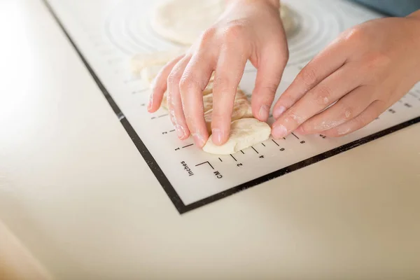 Kitchen baking mat with inch and metric markings for ease of use during the cooking process. Close-up view, selective focus and copy space.