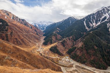 Autumn road in the Big Almaty gorge on Big Almaty Lake.