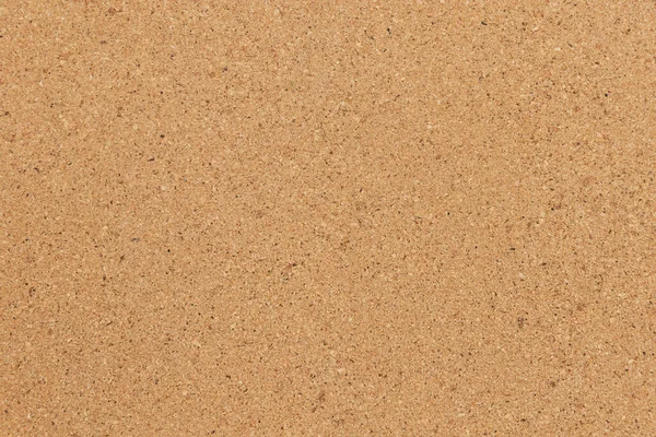 Cork background in beige color. Brown cork texture.