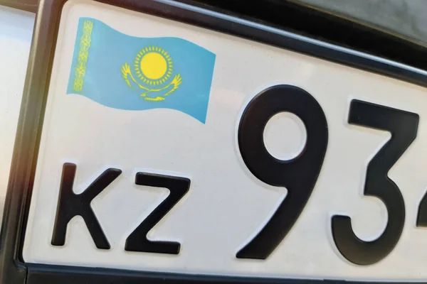State car registration number close-up with the flag of Kazakhstan.