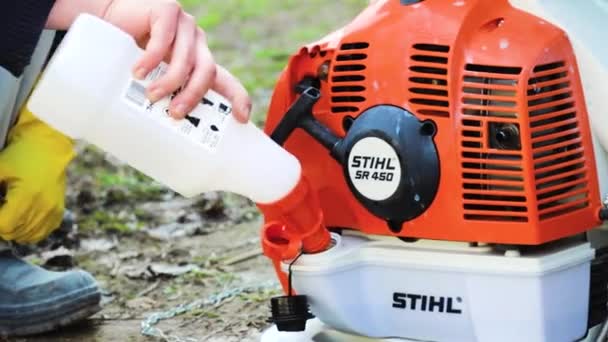 Gardener Has Refueled Engine Garden Sprayer Stihl Sr450 Closes Lid — Stock Video