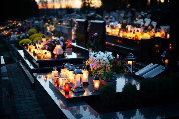 Candle flames illuminating on Polish cemetery during All Saint s Day