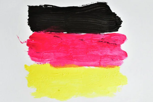 Black, red and yellow lines painted with watercolors similar to the flag of Germany.