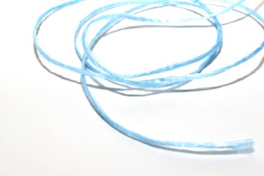 A long string or rope in rings lies on a white background. clipart