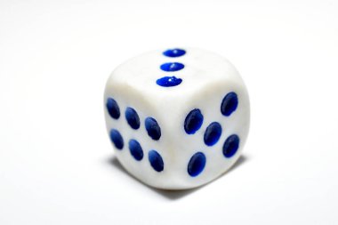 A white and blue playing stone lies on a white background. clipart