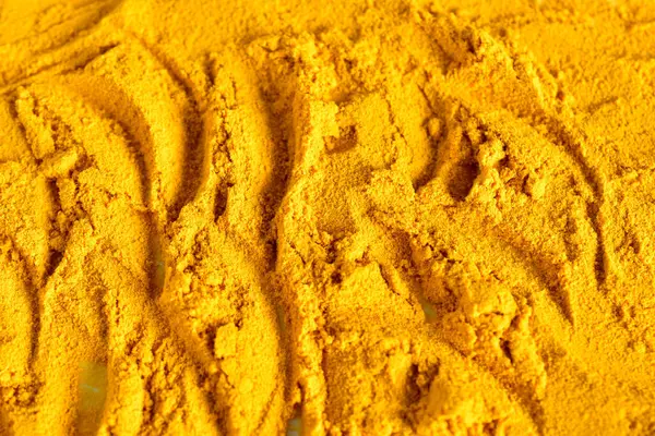 Kuru zemin baharatlı zerdeçal. Doku modeli. Yakın plan..