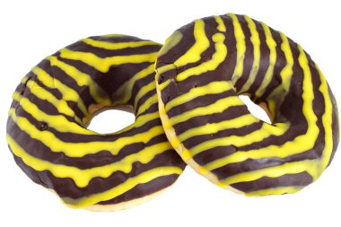 Kalın çikolata jöleli ve parlak sarı zig zag parçalı canlı renkli donutlar..