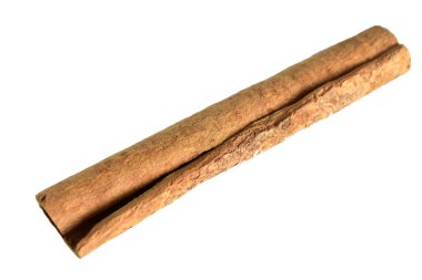 Aromatic dry cinnamon sticks lie on a white background