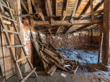 Interior of an abandoned house with decaying materials, showcasing neglect and the passage of time clipart