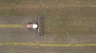 Harvesting flax.Harvesting flax,cotton in fields,ranches and farmlands.Combines mow flax in the field.Agro-industrial complex. A combine harvester cuts cotton in the fields.Cotton Harvesting Machine