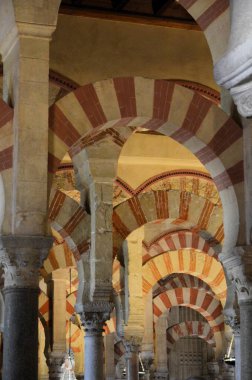 Cordoba, Spain 03.27.2019: Ceiling with double arches of white stone and red brick at the Prayer Hall of Cordoba Mosque now Our Lady Assumption Cathedral Catholic church Spain