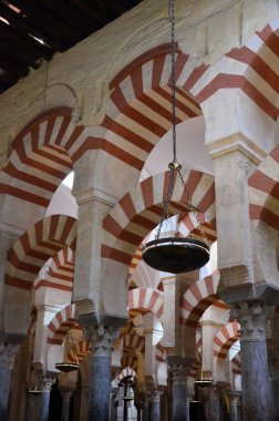 Cordoba, Spain 03.27.2019: Ceiling with double arches of white stone and red brick at the Prayer Hall of Cordoba Mosque now Our Lady Assumption Cathedral Catholic church Spain