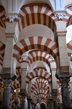 Cordoba, Spain 03.27.2019: Ceiling with double arches of white stone and red brick at the Prayer Hall of Cordoba Mosque now Our Lady Assumption Cathedral Catholic church Spain