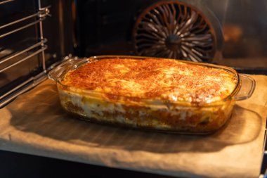 baking self made Italian lasagne, with mozzarella in the oven