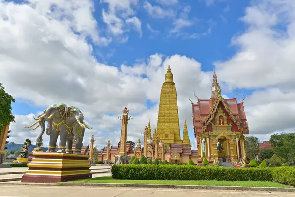 stock image Wat Mahathat Wachiramongkhon or Wat Bang Thong, Krabi Province, Thailand. Beautiful scenery with exterior architecture of buddhist temple under cloudy blue sky during summer.