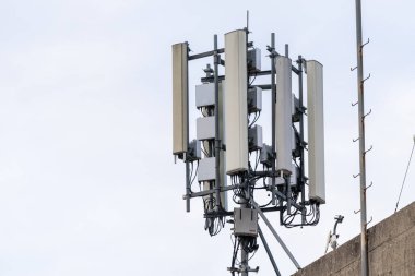 Telecommunication Tower with Multiple Antennas and Cables for Cellular Network Transmission clipart