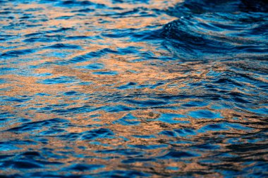 Golden Hour Reflection of Sunlight on Rippling Water Surface in Southern Croatians Coastal Landscape clipart