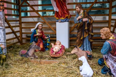 Traditional Nativity Scene with Baby Jesus, Mary, Joseph, and Farm Animals in a Christmas Manger Setting clipart