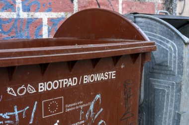 METKOVIC, CROATIA - December 7, 2024: Waste bins for biowaste and general garbage highlighting EU-funded green transition and sustainable waste management initiatives clipart