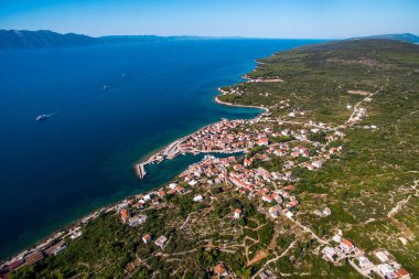 Top Down Aerial View of Sucuraj Harbor and Historic Village on Hvar Island, Croatia. Vibrant Mediterranean Architecture and Turquoise Adriatic Waters clipart