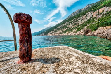 Scenic Coastal Landscape of the Peljesac Peninsula in Croatia Featuring the Adriatic Sea and Rocky Shoreline in the Dingac Region. Crystal clear sea, sky and beach. clipart