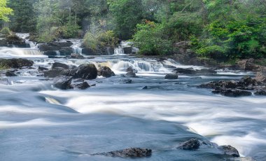 Panorama of a small section of the Falls of Dochart in Killin clipart