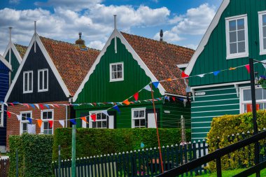 Typical Dutch village scene with wooden houses on the island of Marken in the Netherlands, Holland clipart